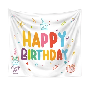 Detail of white polyester birthday tapestry with colorful letters and cake illustrations