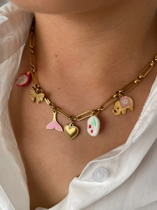 Detailed view of gold link necklace with charms including elephant, fish tail and cherry