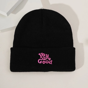 Classic black knitted beanie featuring pink You are Good embroidery for winter casual style
