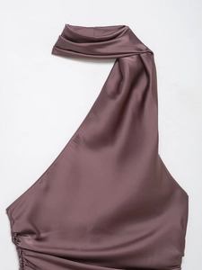 Detailed view of mauve satin halter top with elegant draped pleats and silky texture