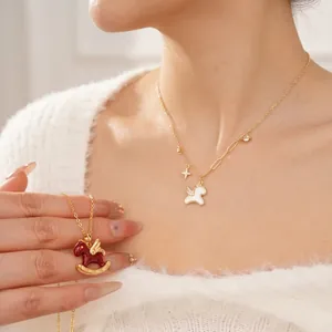 Elegant gold pony necklace with white enamel unicorn pendant and zircon star charms