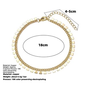 Macro detail of 18K gold plated heart pendant bracelet with adjustable extension chain