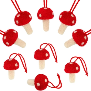 Detailed texture of handmade wool felt mushroom ornaments with red and white spots