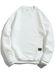 Detailed close-up of white waffle texture knit fabric on slim fit men's long sleeve top