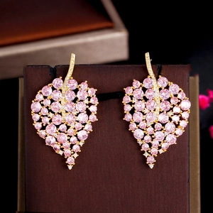 Detail of pink leaf earrings featuring gold plating and sparkling cubic zirconia stones