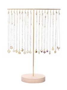 Detail of golden metal T-bar necklace stand with solid wood base for jewelry display