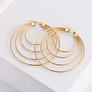 Detailed view of layered gold plated stainless steel spiral hoop earrings for women