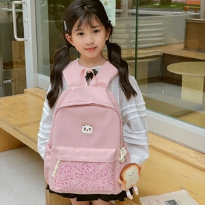 Pink cartoon cat schoolbag with GSHVA print and cute toast charm for kindergarten kids
