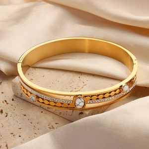 Vintage gold-plated stainless steel cuff with white turquoise stones and rhinestones