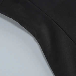 Close-up of premium black fabric texture and neat stitching on this elegant evening dress