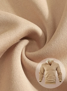 Macro shot of khaki half-zip sweatshirt fabric showing soft knit texture and stitching