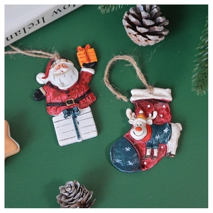 Detail of Santa Claus and reindeer ornaments with rustic jute hanging loops