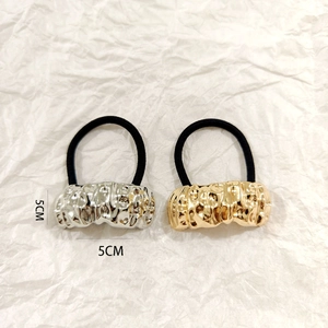 Hollow metal alloy hair ties in gold and silver finish with textured 5CM decorative detail