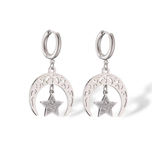 Detailed view of silver moon and star earrings with sparkling zircon inlay details