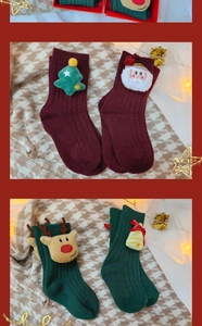 Close-up of 3D reindeer and Santa plush motifs on thick knit Christmas socks