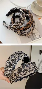 Detailed view of handmade leopard print braided headband with 3D woven texture details