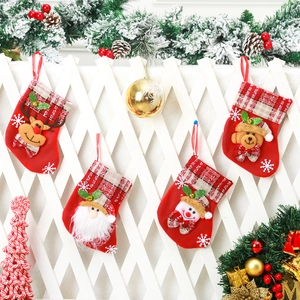 Detailed view of four festive Christmas stockings featuring Santa, elk, bear and snowman