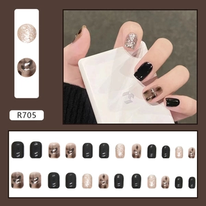 Press-on nail set featuring black marble, leopard print and champagne glitter accents