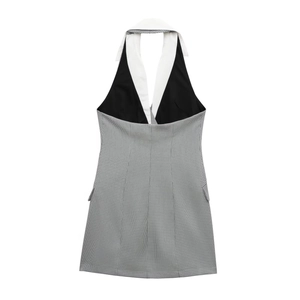 Women's halter neck mini dress featuring black and white plaid stitching with white collar