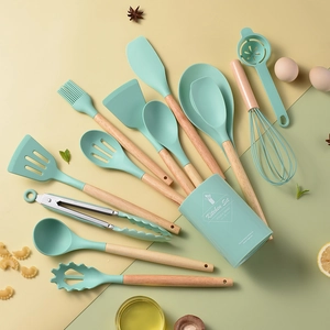 14-piece light green silicone kitchen utensil set with wooden handles and storage bucket