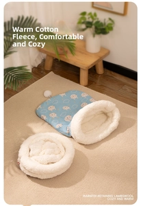 Detail of warm lamb wool interior and cute lamb print pattern on light blue pet sleeping bag