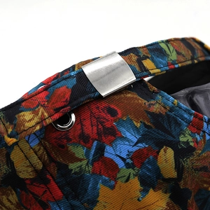 Detail of colorful maple leaf print baseball cap with silver metal adjustable buckle