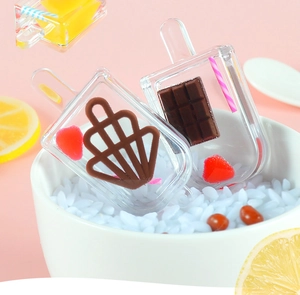 Macro detail of miniature resin ice cream sticks with chocolate and strawberry charms