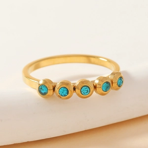 Minimalist gold titanium steel ring with five round blue inset gemstones for women