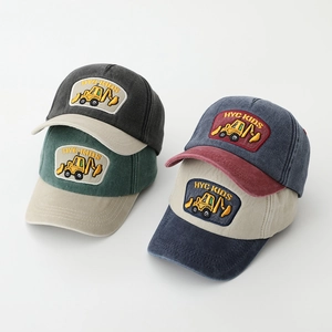 Detailed close-up of HYC-KIDS excavator embroidery on cotton color-block baseball caps