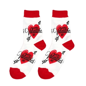 Detail of white cotton socks featuring a red heart and Happy Valentine Day print