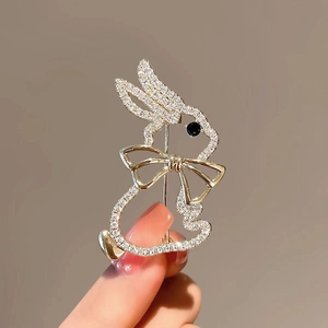 Close-up of a bunny brooch with sparkling rhinestones and a black gemstone eye