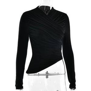 Close-up of black V-neck ruched long sleeve top with asymmetric hem on a mannequin