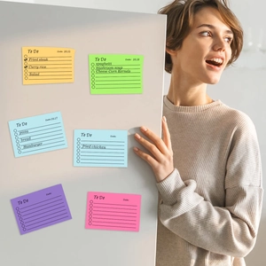 Colorful list sticky notes for to-do planning displayed on a bright white surface