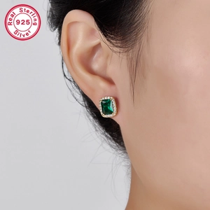 Close-up of S925 sterling silver earring featuring a green square zircon and diamonds