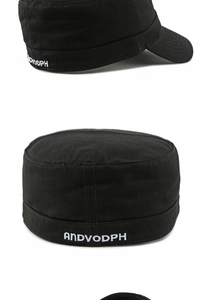 Detail view of black cotton cadet cap showing white ANDVODPH embroidery and twill texture