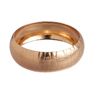 Polished gold wide cuff bracelet featuring realistic embossed snakeskin texture for women