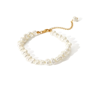 Detail of baroque pearl bracelet with gold lobster clasp and adjustable extension chain