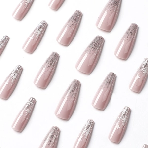 Long coffin press-on nails with rose pink base, silver glitter and white snowflakes