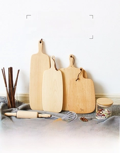 Detailed view of Japanese beech wood cutting boards with leather hanging straps