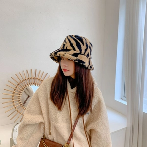 Detailed texture of zebra print plush bucket hat with warm faux fur material