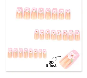 Macro detail of 3D pink cherry blossom relief on gradient press-on nails with gold beads