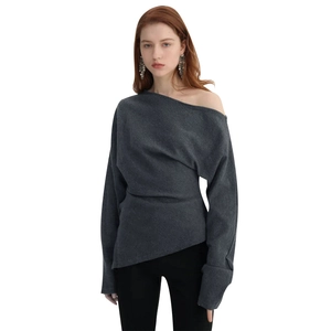 Detail of elegant dark grey asymmetric off-shoulder knitted long sleeve top for women