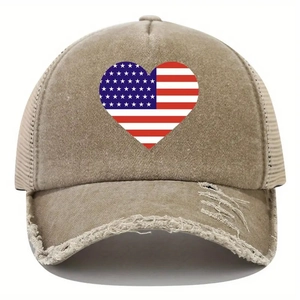 Close-up of distressed beige mesh cap featuring heart-shaped flag print and frayed brim