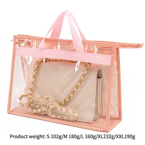 Transparent PVC dustproof handbag organizer with pink handles and zipper closure