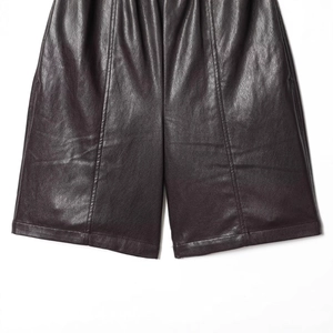 Women's high-waisted elastic faux leather shorts in deep burgundy with smooth texture