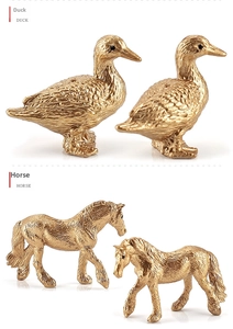 Macro detail of golden miniature horse and duck figurines with realistic textures