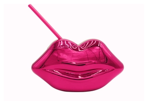 Macro detail of disco-style pink mirror-plated lip-shaped plastic cup with a matching straw