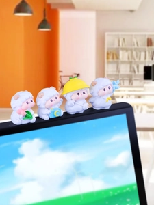 Set of four cute cartoon resin sheep figurines used as computer monitor decorations