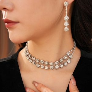 Close-up of model wearing double-layer flower necklace and diamond tassel earrings set