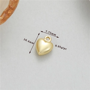 Macro shot of a 14K gold plated heart pendant with 10.4mm by 7.75mm dimensions